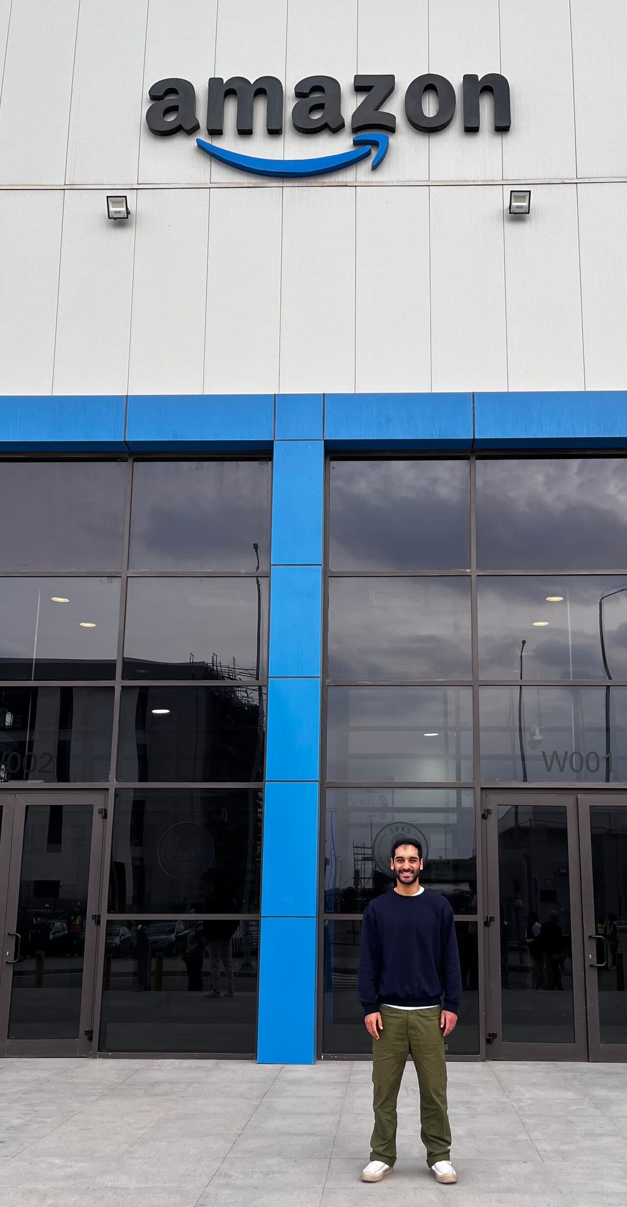 Adel outside an Amazon warehouse during the Transcend Competition visit