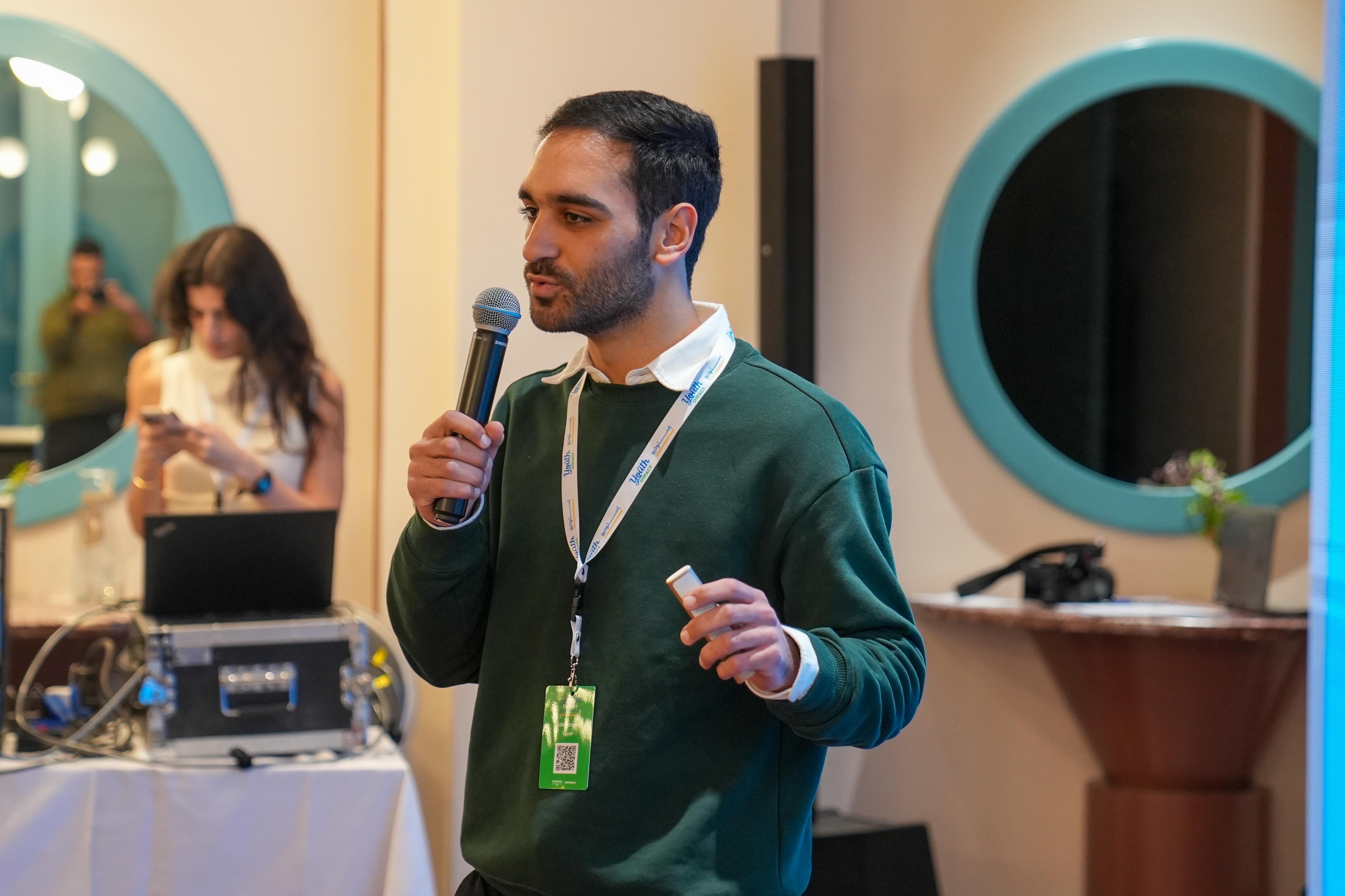 Adel presenting during the Impact Shark Tank Challenge